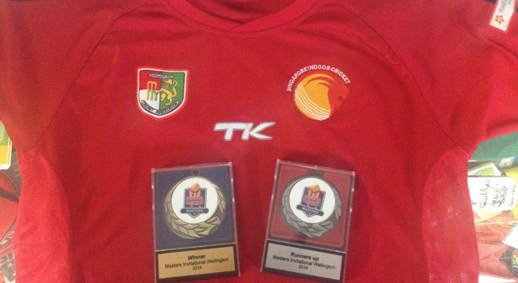 Photo of a signed Singapore team shirt, plus Winners and Runners-up medals